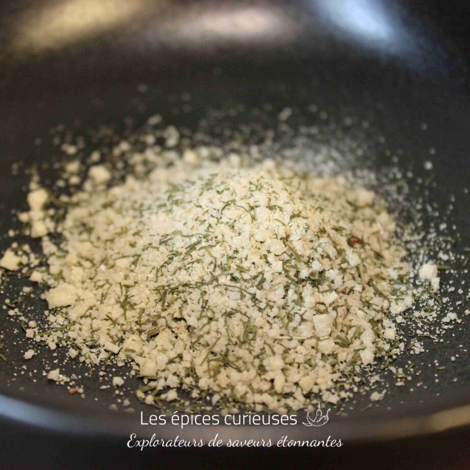 Mélange d'épices aromatiques sur fond noir, idéal pour cuisiner et rehausser les saveurs des plats.