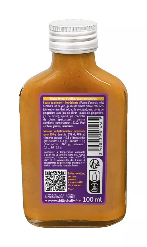 Bouteille de sauce piquante avec étiquette détaillant ingrédients, valeurs nutritionnelles et code QR pour recettes.