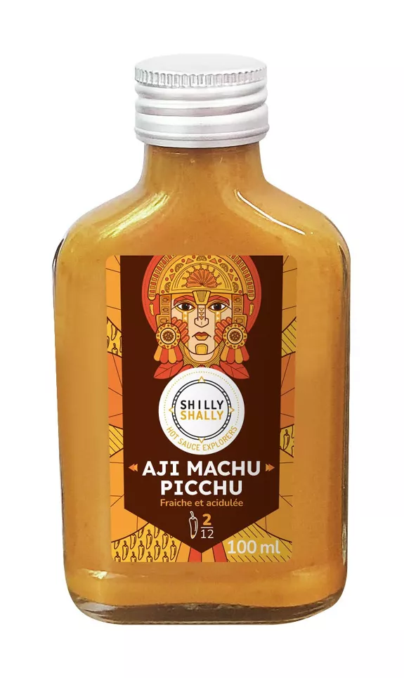 Bouteille de sauce piquante Aji Machu Picchu, fraîche et acidulée, de 100 ml avec étiquette colorée inspirée de l'art péruvien.